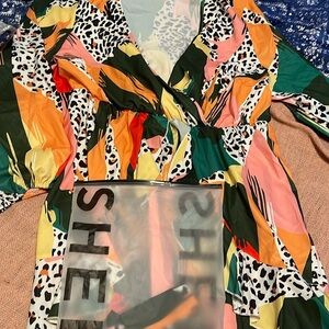 Cute dress lots of colors very loose fitting. Nice v neck.